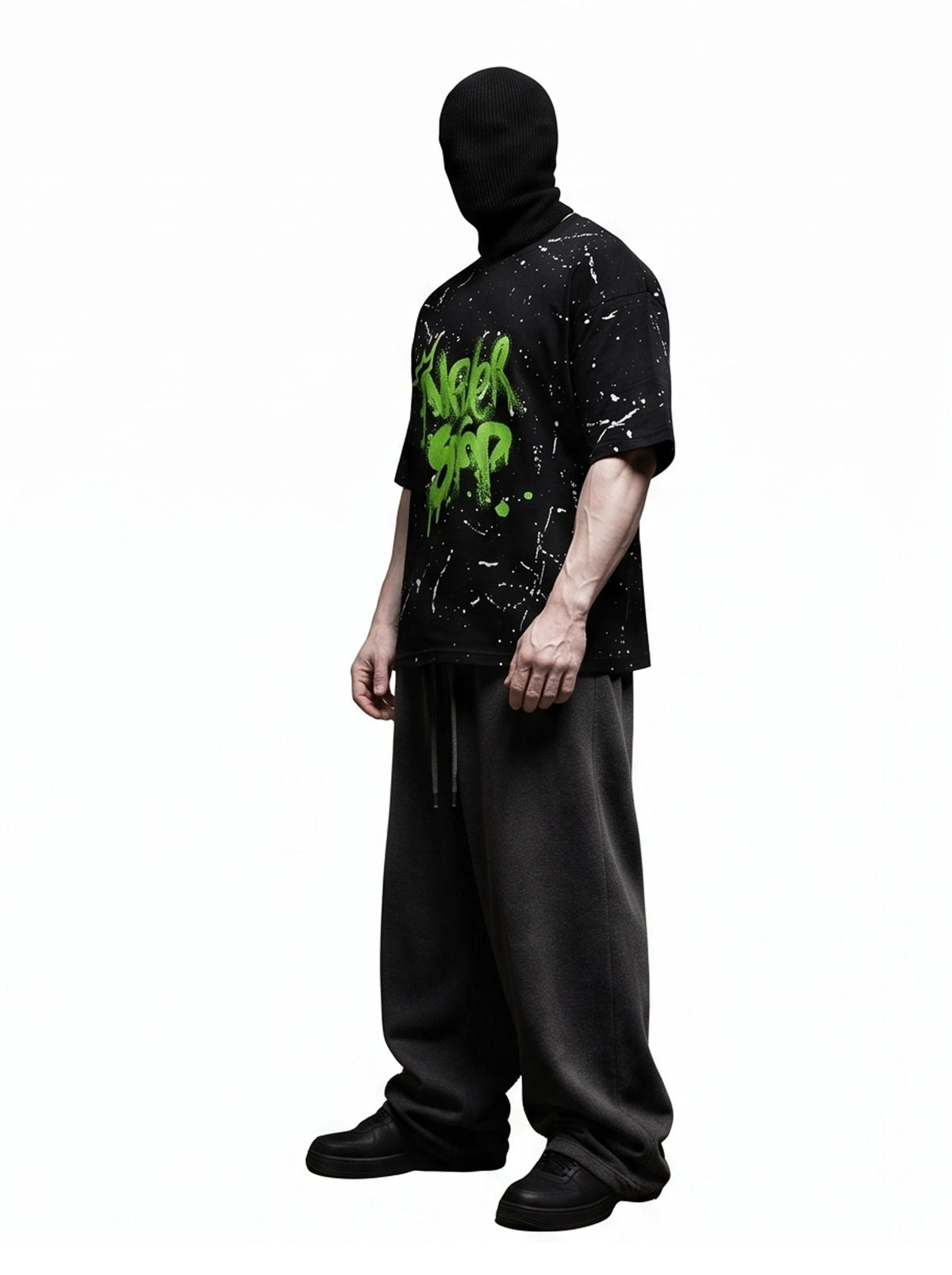 "NEVER STOP" Oversized Streetwear T-Shirt – All-Over Splatter Print (Black)